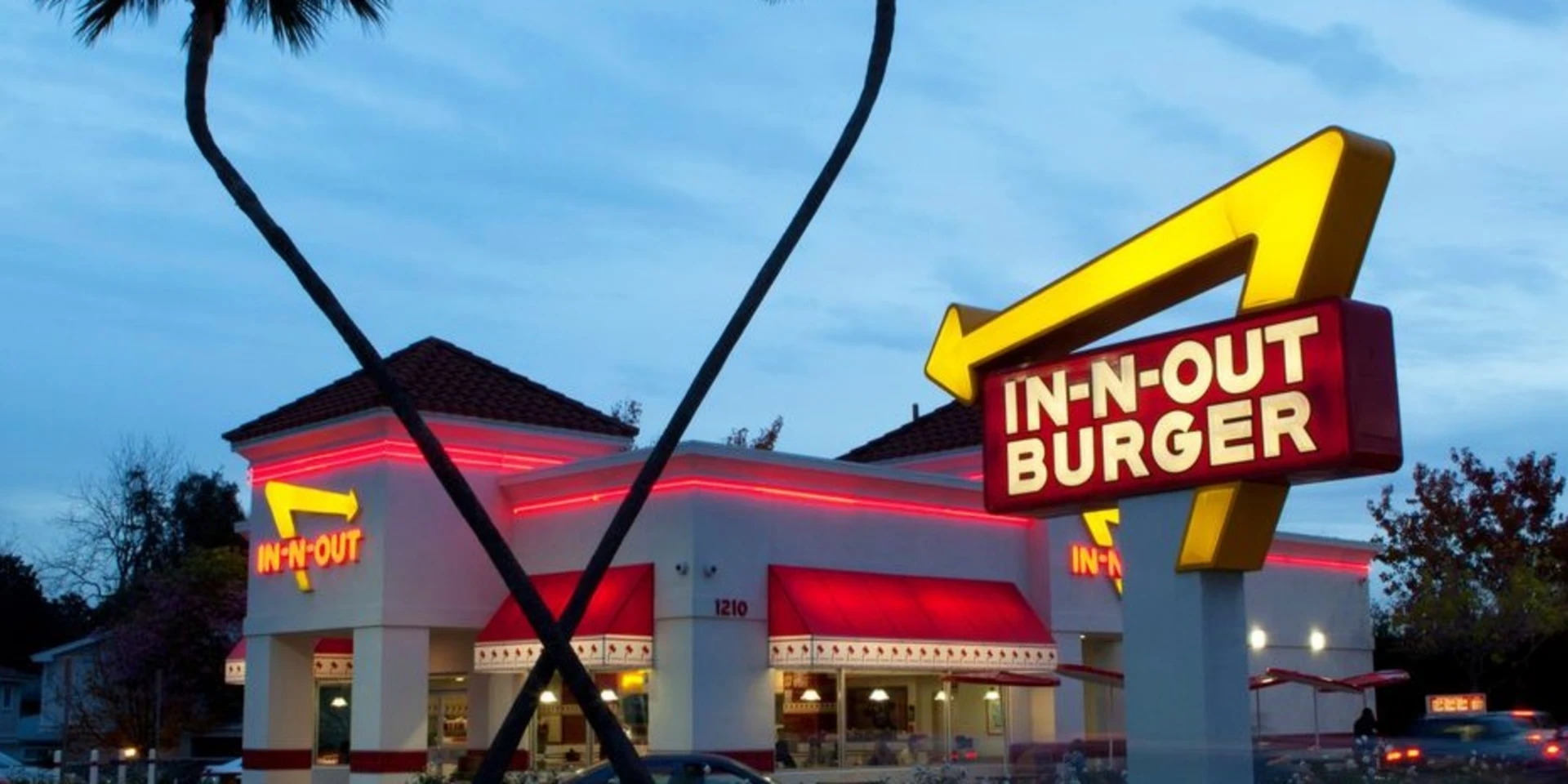 In-N-Out Burger restaurant and neon sign at dusk